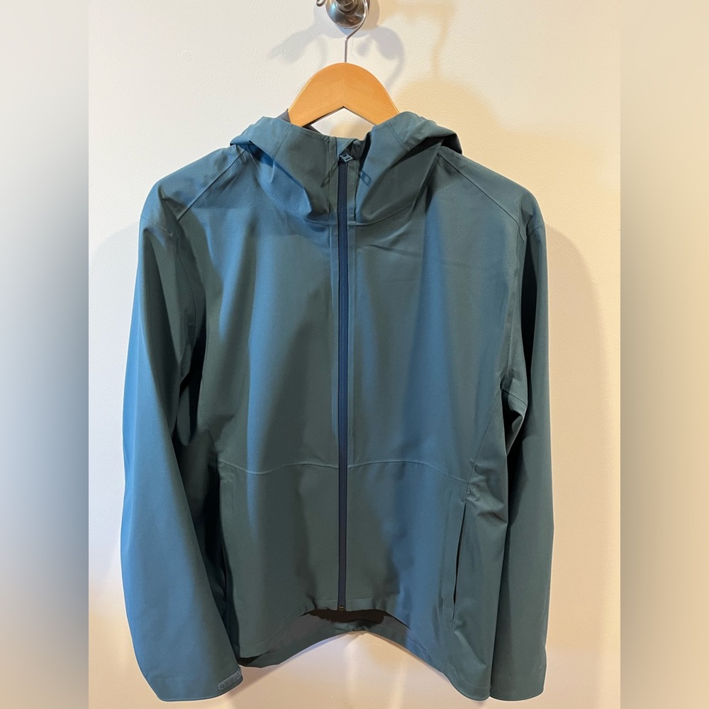 Uniqlo Blocktech Rain Parka w/ hood. New. Never been worn. No tags. Color teal.